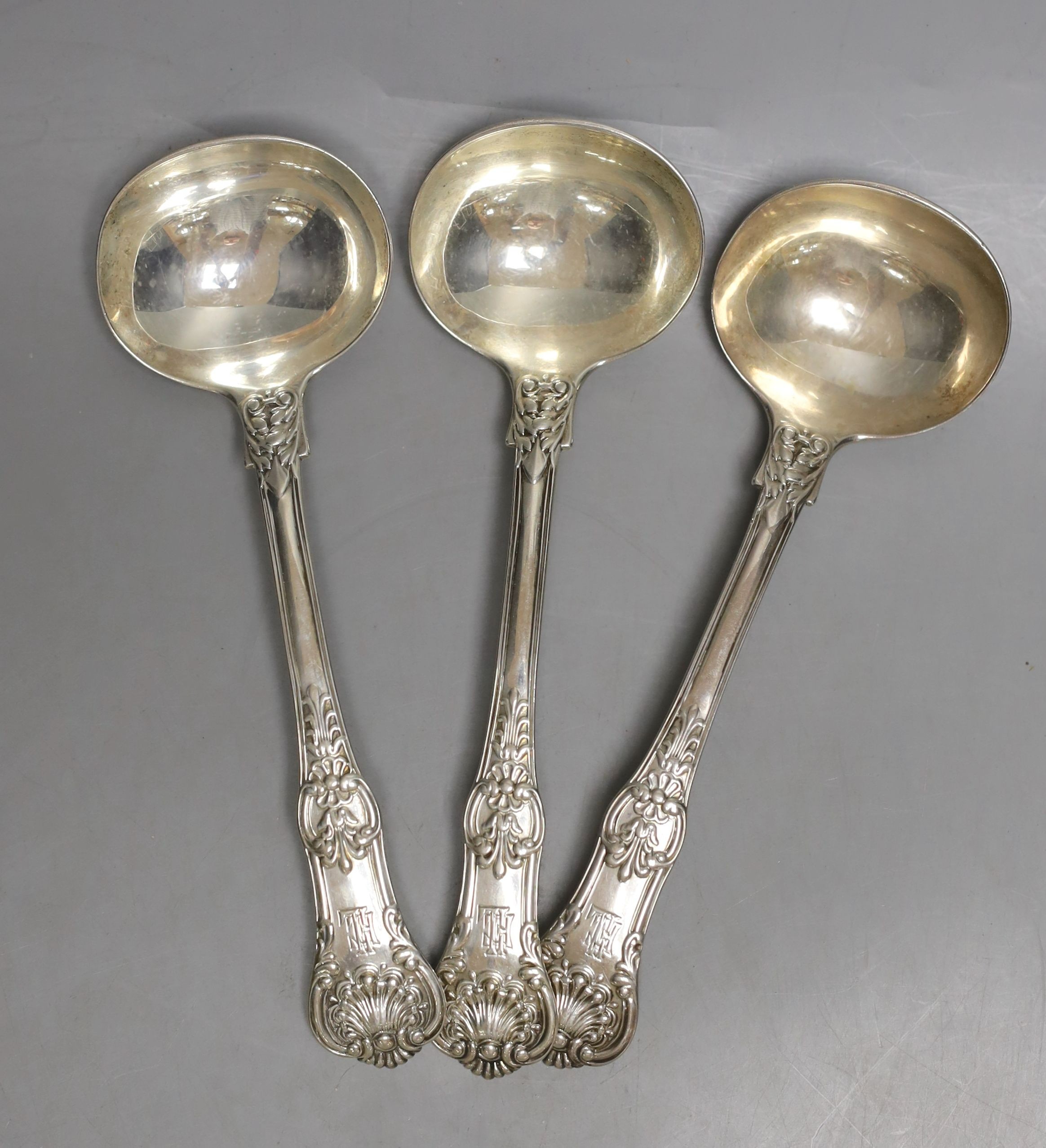 A set of three George IV silver honeysuckle pattern sauce ladles, John Harris IV, London, 1827, 17.9cm, 287 grams.